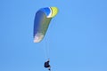 Paraglider flying in a blue sky Royalty Free Stock Photo
