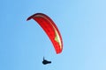 Paraglider flying in a blue sky Royalty Free Stock Photo