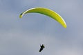 Paraglider flying in a cloudy sky Royalty Free Stock Photo