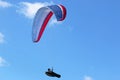 Paraglider flying in a blue sky Royalty Free Stock Photo