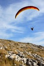 Paraglider flying low