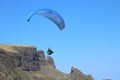 Paraglider flying off Scottish mountain