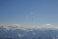 Paraglider flying over the Austrian Apls on the sunny day Royalty Free Stock Photo