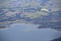 Paraglider flying over Bavarian lake Royalty Free Stock Photo