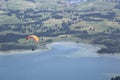 Paraglider flying over Bavarian lake Royalty Free Stock Photo