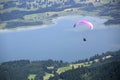 Paraglider flying over Bavarian mountains Royalty Free Stock Photo
