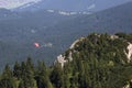 Paraglider flying over Bavarian mountains Royalty Free Stock Photo