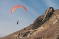 Paraglider flying over mountains Royalty Free Stock Photo