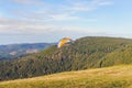 Paraglider flying over mountains summer day Royalty Free Stock Photo