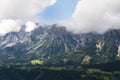 Paraglider flying over Schladming, Dachstein mountains background, Alps, Austria Royalty Free Stock Photo