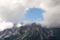 Paraglider flying over Schladming, Dachstein mountains background, Alps, Austria Royalty Free Stock Photo