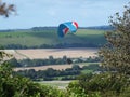 Paraglider flying over the south downs