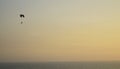 Paraglider flying over a sunset without people in the Pacific Ocean Royalty Free Stock Photo