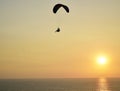 Paraglider flying over a sunset without people in the Pacific Ocean Royalty Free Stock Photo