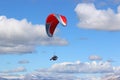 Red paraglider in a blue sky Royalty Free Stock Photo