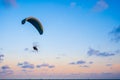 Paraglider flying on sky at sunset Royalty Free Stock Photo