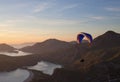 Paraglider flying at sunset in Oludeniz, Turkey