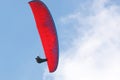 Paraglider flying wing in a blue sky Royalty Free Stock Photo