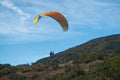 Paraglider going to land in a field Royalty Free Stock Photo