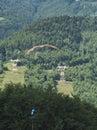 paraglider in a hillty terrain