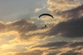 Silhouette of paraglider soaring at sunset Royalty Free Stock Photo