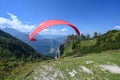 A paraglider ist taking off near the mountain Jenner at the lake Koenigssee