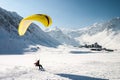 Paraglider landing on skis