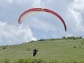Paraglider landing wing in a meadow