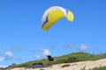 Paraglider launching above Victory Walls beach