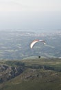 Paraglider man above Atlantic coast Royalty Free Stock Photo