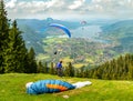 Paraglider on Mount Wallberg with the Tegernsee in the background.