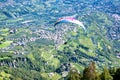 Paraglider above Dorf Tirol,  vacation resort with apple orchads, Tirol Castle, hiking trails, , Alto Adige, South Tyrol, Italy Royalty Free Stock Photo