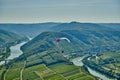 Paraglider over Moselle River bend near Bremm town, Germany Royalty Free Stock Photo