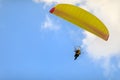 A powered paraglider pilot in flight over the landscape Royalty Free Stock Photo