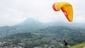 Paraglider pilot flying after taking off from hill Royalty Free Stock Photo