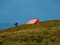 Paraglider preparing for takeoff from Bishop Hill,Loch Leven,Scotland Royalty Free Stock Photo