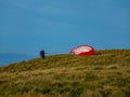 Paraglider preparing for takeoff from Bishop Hill,Loch Leven,Scotland