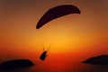 Paraglider silhouette against the background of the sunset sky Royalty Free Stock Photo