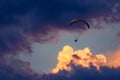 Paraglider silhouette flying in a cloudy sky Royalty Free Stock Photo