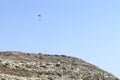 Paraglider in the sky over a mountain slope Royalty Free Stock Photo