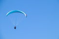 Paraglider soaring in the blue sky. Royalty Free Stock Photo