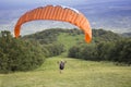 Paraglider taking off from the edge of the mountain Royalty Free Stock Photo