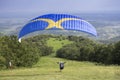 Paraglider taking off from the edge of the mountain Royalty Free Stock Photo