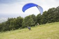 Paraglider taking off from the edge of the mountain Royalty Free Stock Photo