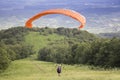 Paraglider taking off from the edge of the mountain Royalty Free Stock Photo