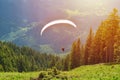 Paraglider taking off in front of spectacular mountain scenery Royalty Free Stock Photo