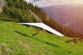 Paraglider taking off in front of spectacular mountain scenery Royalty Free Stock Photo