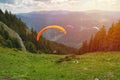 Paraglider taking off in front of spectacular mountain scenery Royalty Free Stock Photo