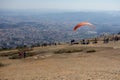 Paraglider taking off from Pedra Grande, a stone hill in Atibaia, Sao Paulo, Brazil. huge rock formation of natural monument