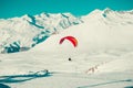 Paraglider tandem flying over Gudauri . Colorful parachute. Active lifestyle, Extreme hobbies. Paragliding, explore Georgia. Adven